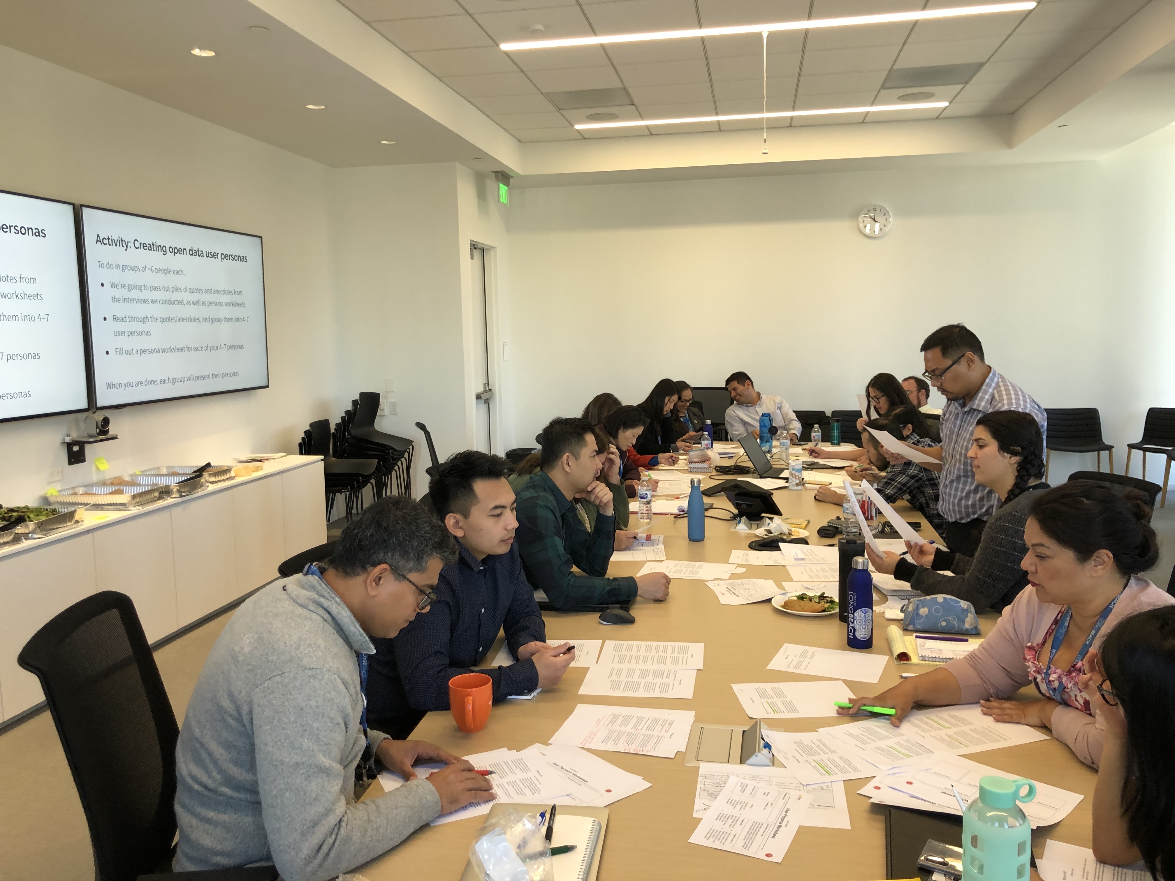 Workshop participants sitting at a table and working